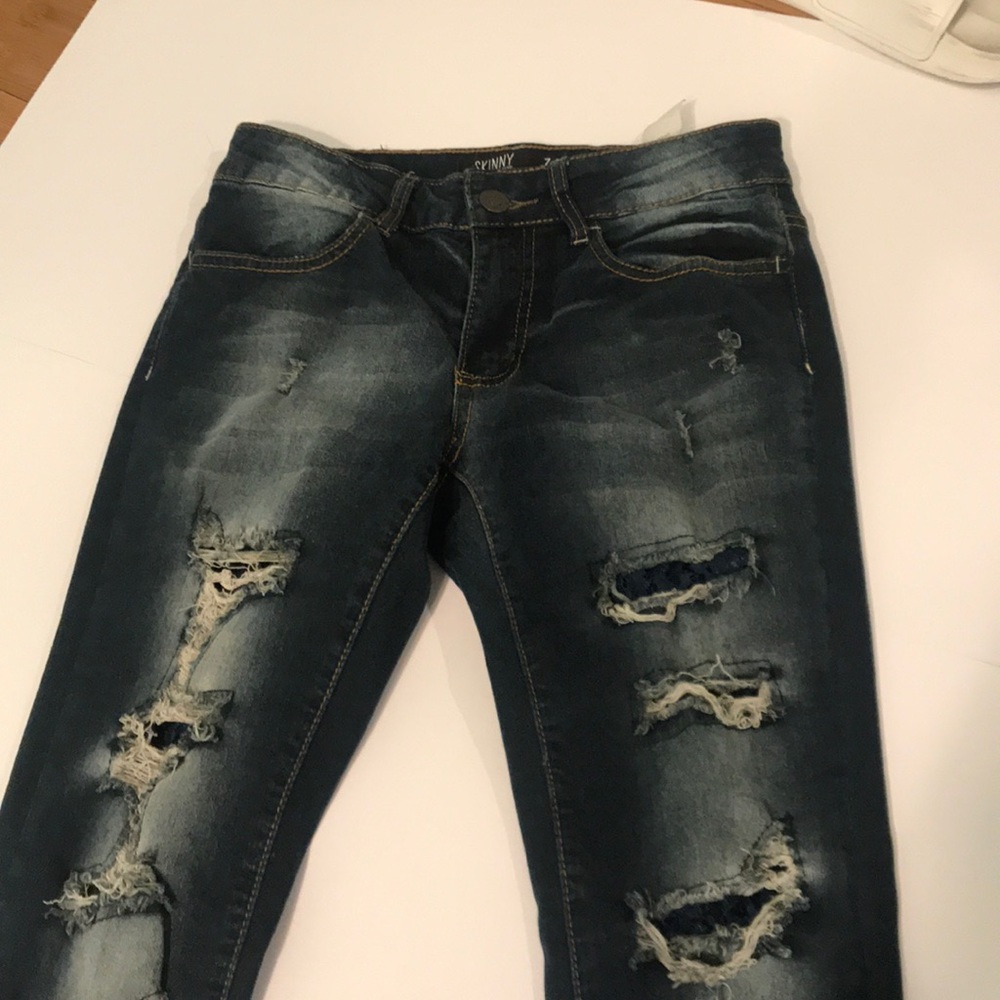 Low rise dark wash ripped jeans